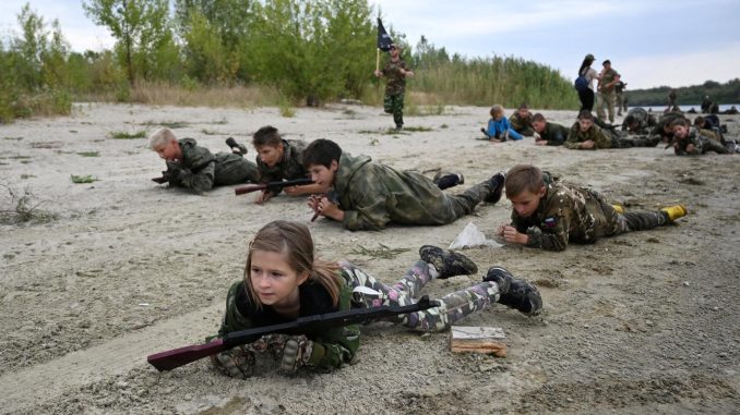 Russian Children as Young as 8 Handle AK-47s and Grenades in Military Camp Drill Russian Children as Young as 8 Handle AK-47s and Grenades in Military Camp Drill